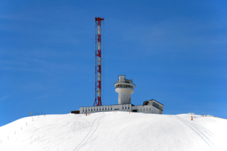 Mountaintop lookout station with radio mast