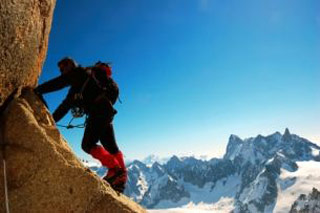 Climber in snow-covered mountains